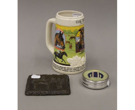 Prince of Wales and Persimmon cold cast paperweight, a jockey's silks needlework inset trinket box and cover, and a stein