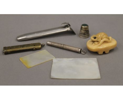 A small quantity of miscellaneous items, including a silver propelling pencil, a netsuke, mother-of-pearl counter, etc.