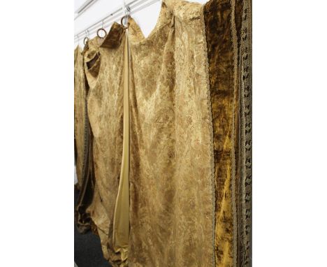 A pair of heavy brocaded velvet curtains and a single en-suite, with period curtain rings attached