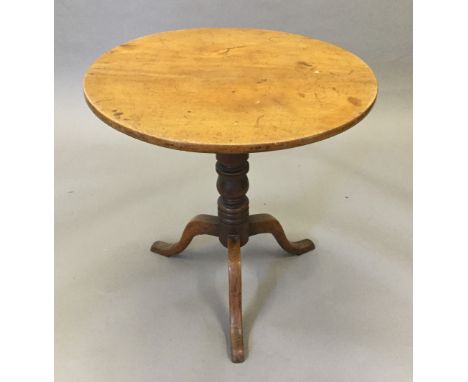 A 19th century mahogany tripod table, the block with period inscribed label and stamped TL. 71 cm diameter.