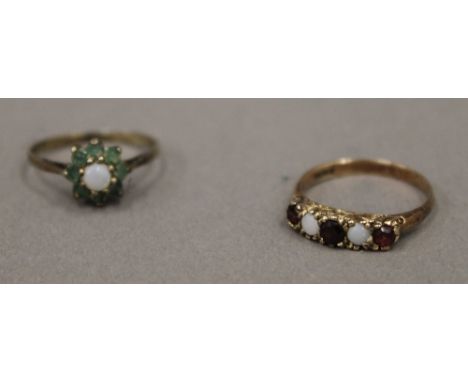 A gold opal and ruby set five stone ring, marks rubbed, size M (2 grammes total weight) and another, size N (1 gram total wei