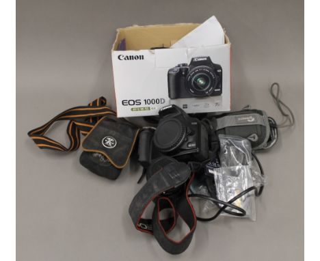 A quantity of 35mm camera equipment comprising: Canon EOS 1000D and lens and digital cameras