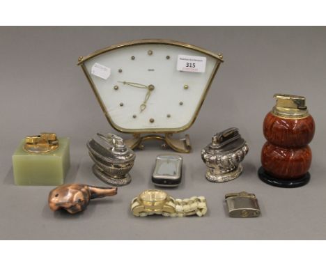 A quantity of vintage lighters including Ronson, a vintage Smiths mantle clock and a River Island gentleman's wristwatch