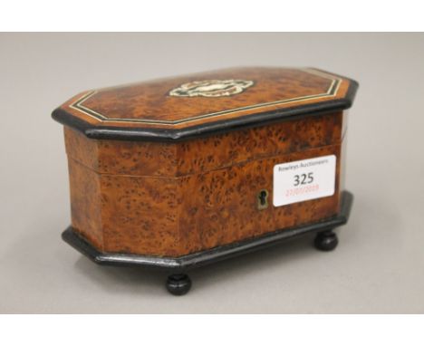 A small 19th century French inlaid amboyna trinket box, with key