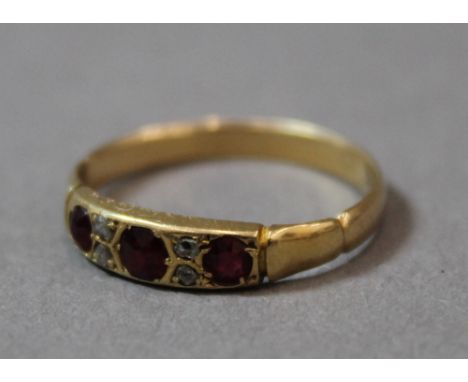 A 9 ct gold diamond and ruby ring (1.7 grammes total weight)