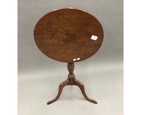 A George III mahogany country tripod table with tilt top, 54 cm diameter