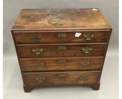 A George III mahogany caddy top chest of four long drawers with crossbanded top, 82 cm wide