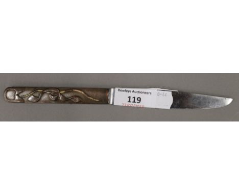 A 19th century Japanese knife with signed steel blade, the copper and gold grip decorated with an archers bow and a scroll