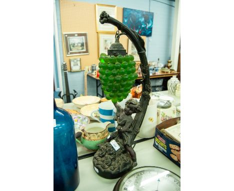 COMPOSITION FIGURAL ELECTRIC TABLE LAMP WITH GREEN 'GRAPE' SHADE