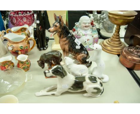 THREE RUSSIAN CHINA MODELS viz  A WHITE POLE CAT, A POLAR BEAR, A BLACK BEAR on a stand, a reclining LURCHER DOG AND A GOEBEL