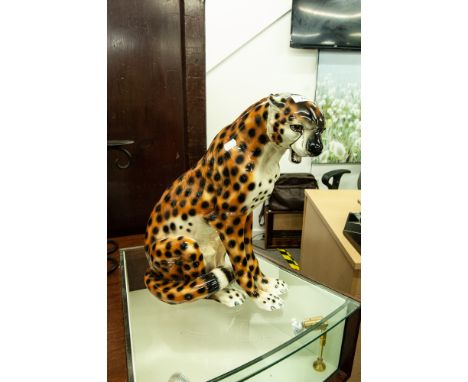 LARGE POTTERY MODEL OF A SEATED LEOPARD, 18" HIGH