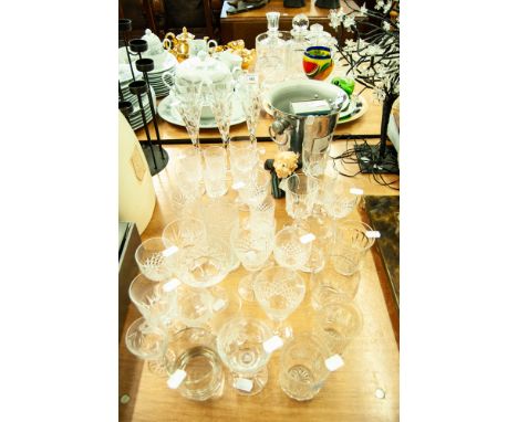 SET OF SIX GLASS CHAMPAGNE FLUTES; VARIOUS DRINKING GLASSES; A METAL ICE BUCKET; A RESIN 'WINE WAITER' BOTTLE STAND; A CORKSC