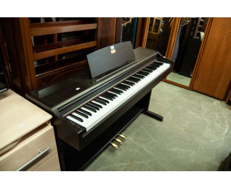 CASIO CELVIANO DIGITAL ELECTRONIC PIANO IN BLACK FLOOR STANDING CASE AND THE PIANO STOOL ON TUBULAR METAL SUPPORTS