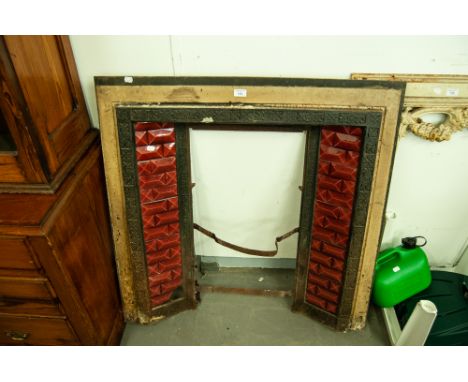 LATE VICTORIAN/EDWARDIAN CAST IRON AND FACETED RED GLAZED CERAMIC TILE INSET FIRE SURROUND