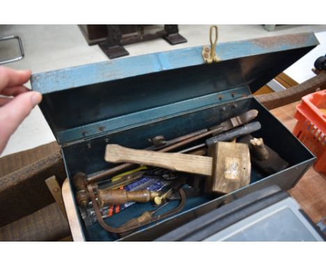 A metal toolbox and contents