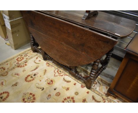 A period oak gateleg table having bobbin style turned frame, width approx. 137cm
