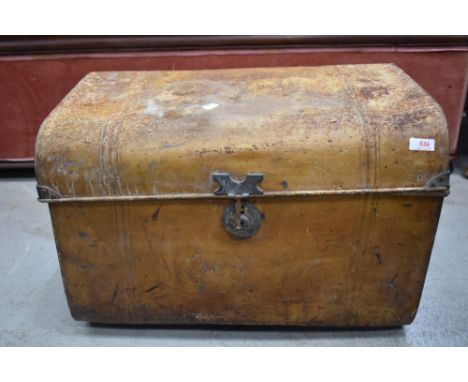 A traditional tin trunk, of compact size
