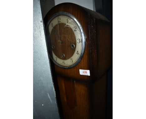 A traditional oak 'grandmother' clock, dial named Enfield