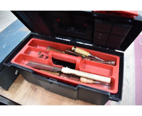 A plastic toolbox and contents