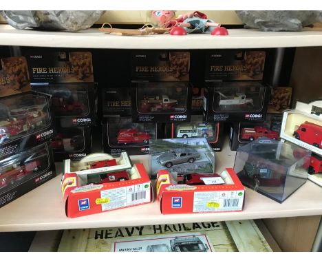 A shelf full of Corgi fire heroes all boxed, Days gone royal mail vans and 007 James Bond model car 