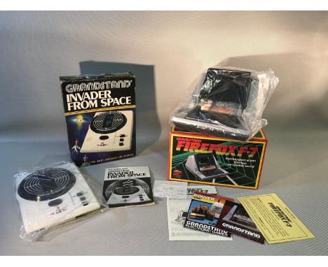 A lot of two vintage Grandstand games; 'Firefox F-7' & 'Invader From Space' complete with original boxes & manuals 
