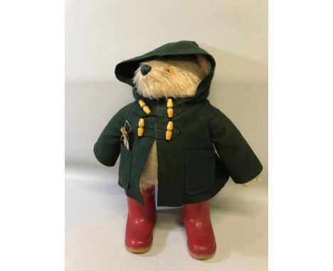 Original Paddington Bear Teddy with green goat, red dunlop wellies, red hat & tag. Stands 45cm in height. 