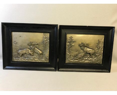 A Pair of WMF German silver plated relief plaques featuring fighting stags by Fitz Diller (1875-1945) Fitted within their ori