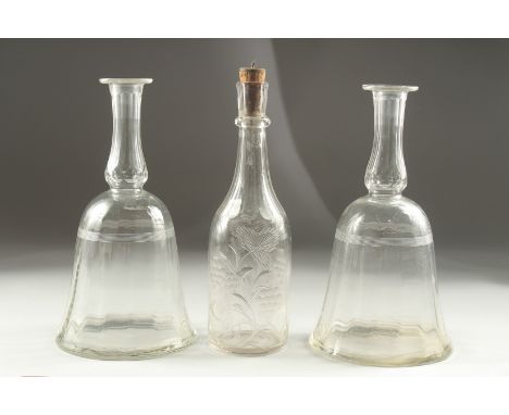 A PAIR OF GEORGIAN BELL SHAPE DECANTERS (no stoppers) and an engraved decanter (3).