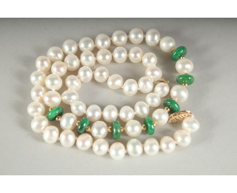 A STRING OF 53 PEARLS AND 7 JADE PIECES.
