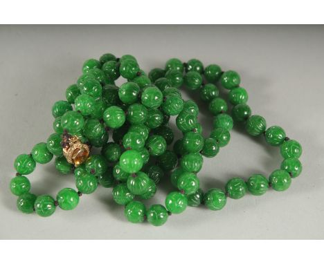 A SUPERB CARVED JADE DOUBLE ROW NECKLACE with citrine and diamond clasp.