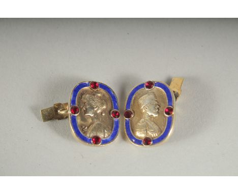 A PAIR OF RUSSIAN SILVER AND BLUE ENAMEL CUFF LINKS.