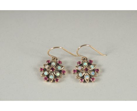 A PAIR OF 9CT GOLD RUBY AND OPAL EARRINGS.