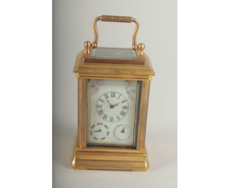 A MINIATURE CARRIAGE CLOCK with Sevres panel. 8cm high.