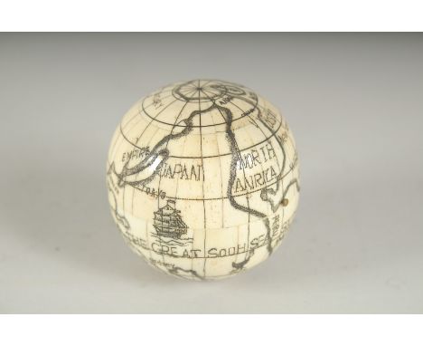 A LARGE ETCHED BONE FOLDING GLOBE COMPASS. 2.5ins diameter.