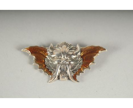 A SILVER AND ENAMEL DEVIL BROOCH.