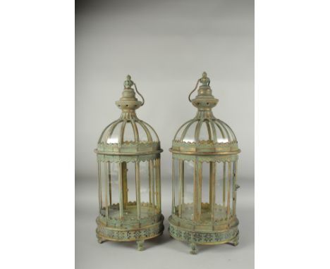 A PAIR OF METAL CIRCULAR LANTERNS with ring handles. 26ins high.
