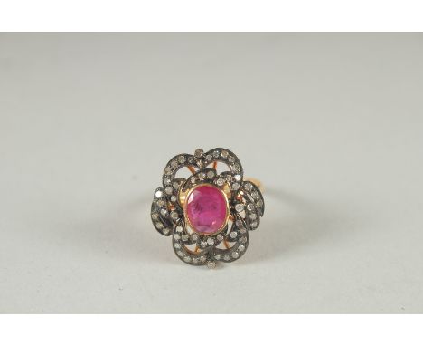 A GOLD AND SILVER RUBY AND DIAMOND RING.