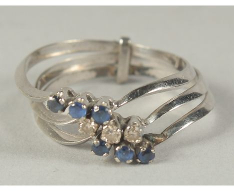 AN 18CT WHITE GOLD TRIPLE RING set with diamonds and sapphires in a box.