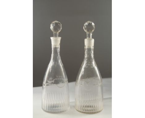 A PAIR OF GEORGIAN ENGRAVED DECANTER AND STOPPER.