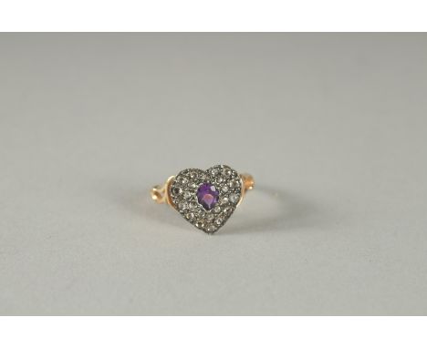 A ROSE GOLD DIAMOND AND AMETHYST HEART SHAPED RING.