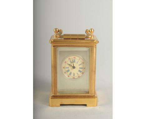 A MINIATURE CARRIAGE CLOCK with Sevres panel. 6cm high.