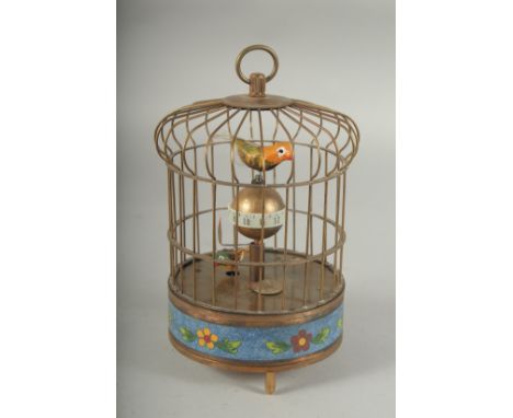 A BIRDCAGE CLOCK with cloisonne  enamel base. 7.5ins high.
