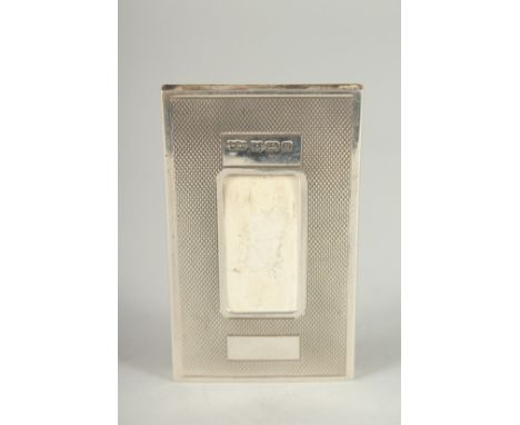 AN ENGINE TURNED SILVER CARD HOLDER. 3ins x 1.75ins. Birmingham.