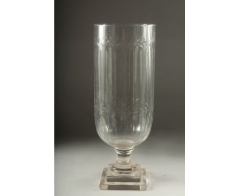 A SINGLE GLASS STORM LANTERN on a square stepped base. 15ins high.