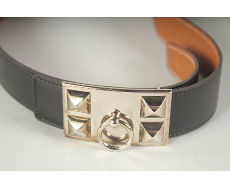 A HERMES BLACK LEATHER BAG with metal ring buckle.