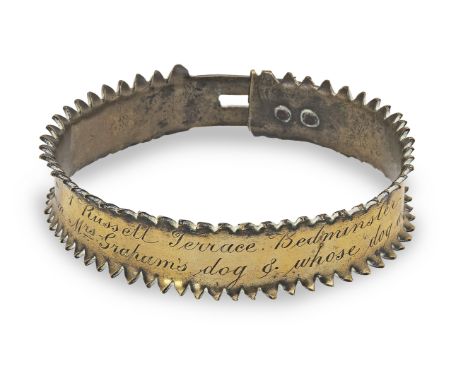 A small mid-19th century brass dog collarWith notched edge forming spikes, and engraved '1 Russell Terrace . Bedminster / I a