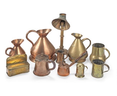 Eleven items of domestic brass and copperThe brass items comprising, a 1/2 gallon brass measuring jug, 24.5cm high, a mid-19t