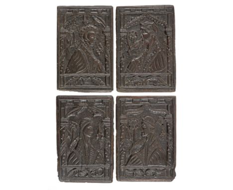 A rare set of four mid-16th century carved oak portrait panels, English, circa 1550Of two men and two women, all elaborately 