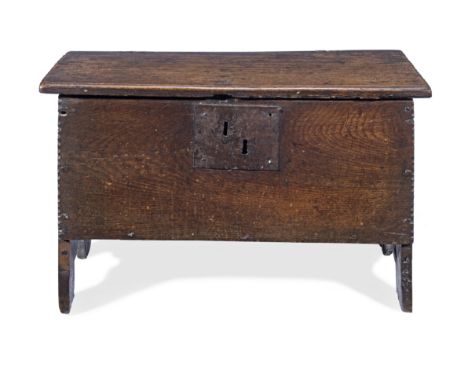 A small Charles I boarded oak chest, West Country, circa 1640The single-piece top and front with chip-carved ends, the extend