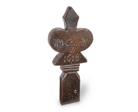 A James I oak finial, dated 1618Of stylised poppy-head shape, and carved 'WM Church / W / 1618', 19.5cm wide x 4cm deep x 40.